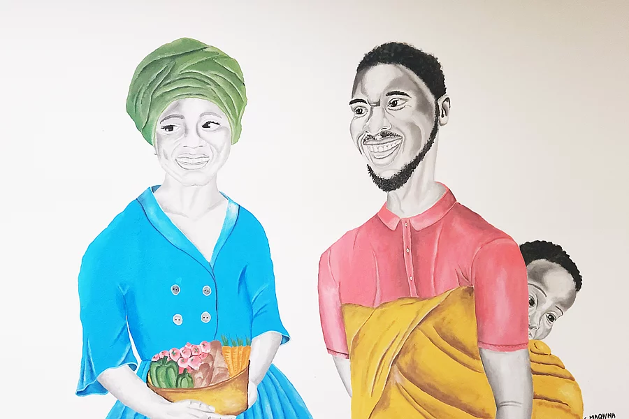 Colourful portrait-style mural showing a woman wearing a green headwrap and blue button-front dress, smiling and holding a basket filled with pink flowers and vegetables. Beside her stands a bearded man in a pink shirt with a baby peeking out from a yellow cloth wrap on his back. Both figures are rendered with grayscale faces against a colourful, illustrated style, with the artist's signature visible in the lower right.